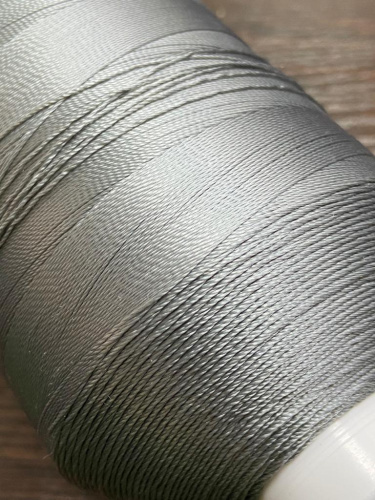 Лавсановая нить для оверлока св.серая Вторичная фото 5